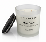 J | F Candle Co Rose Petals 12oz luxury soy candle in frosted glass jar with wooden lid beside it, clean product photo with soft reflection and no website text