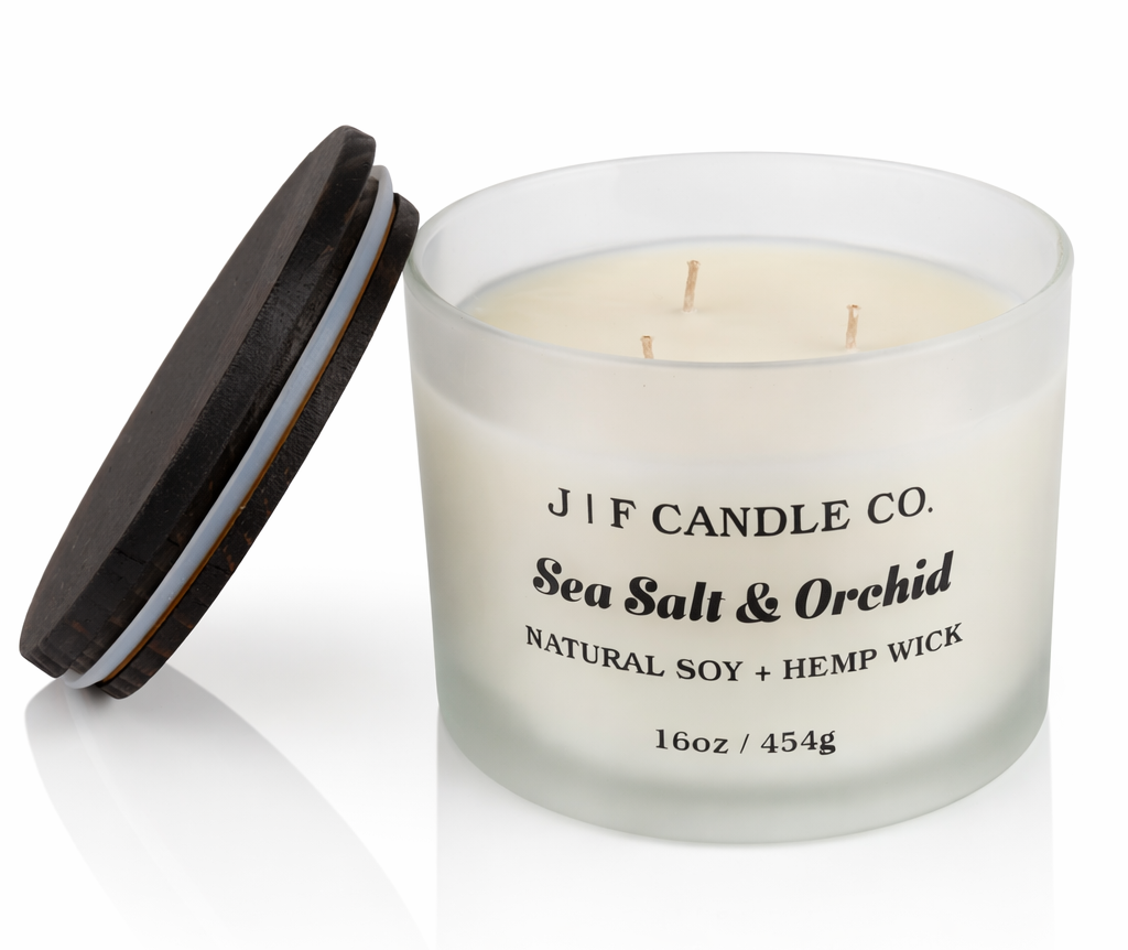 Luxury Sea Salt & Orchid soy candle by J | F Candle Co. in frosted glass jar with wood lid, clean-burning hemp wick, 16 oz candle with soft reflection