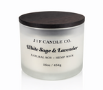 White Sage & Lavender 16 oz soy candle by J | F Candle Co. in frosted glass jar with wooden lid, clean white background with soft reflection, hand-poured luxury candle