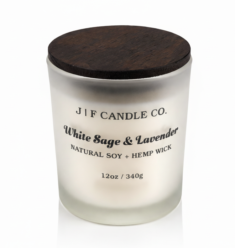 White Sage & Lavender soy candle by J | F Candle Co. in frosted glass jar with wooden lid, clean white background and soft reflection, luxury hand-poured candle
